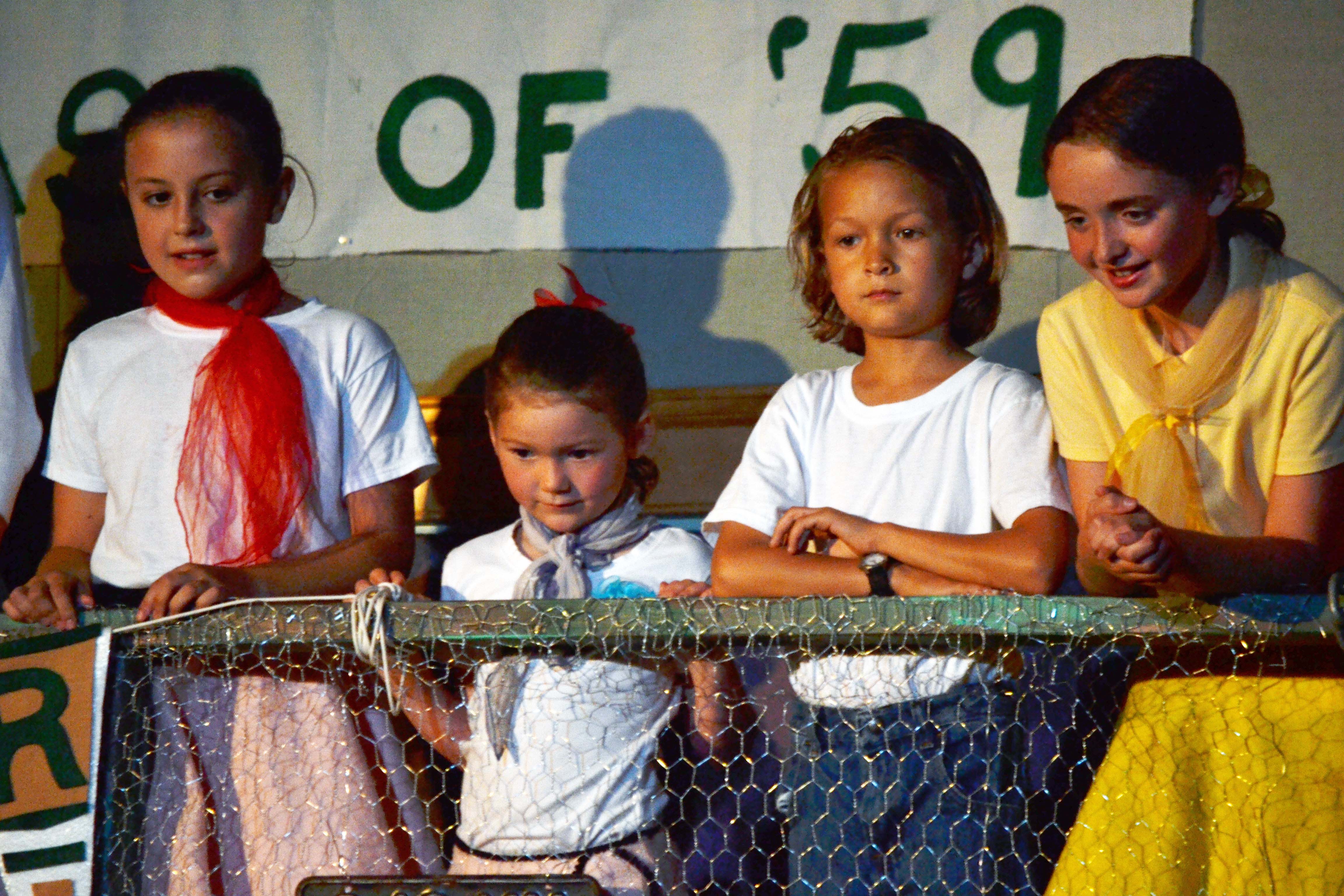 kids on balcony in grease